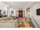 Spacious living area showcasing a sliding barn door, hardwood floors, and modern staircase at 132 Lakeshore Dr, Roswell, GA 30075