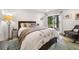 Charming main bedroom with a large bed, sliding glass door, and neutral decor at 132 Lakeshore Dr, Roswell, GA 30075