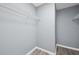 Walk-in closet with wire shelving and wood-look flooring at 2470 Hillvale Cir, Lithonia, GA 30058