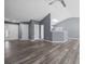Open living space with high ceilings, laminate flooring, and neutral paint at 2470 Hillvale Cir, Lithonia, GA 30058
