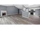 Open-concept layout with a fireplace, adjacent to kitchen with modern appliances and sleek cabinetry at 2470 Hillvale Cir, Lithonia, GA 30058