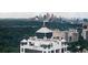 Scenic aerial of building showcasing rooftop sunrooms with the city skyline at 2828 Peachtree Nw Rd # P 3300, Atlanta, GA 30305