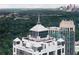 Aerial view of rooftop sunrooms and lush green landscape with city skyline views at 2828 Peachtree Nw Rd # P 3300, Atlanta, GA 30305