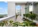 Wide balcony with plants lining the rail and a distant city view at 2828 Peachtree Nw Rd # P 3300, Atlanta, GA 30305