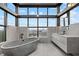Contemporary bathroom with a freestanding tub, city views, and a modern vanity at 2828 Peachtree Nw Rd # P 3300, Atlanta, GA 30305