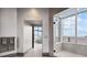 Bright luxury bathroom features walk-in shower with city views and towel racks at 2828 Peachtree Nw Rd # P 3300, Atlanta, GA 30305