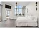 White bedroom features large windows, a full-size bed, and city views at 2828 Peachtree Nw Rd # P 3300, Atlanta, GA 30305