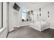 Bright bedroom with gray tile, a decorative bed, and a large window at 2828 Peachtree Nw Rd # P 3300, Atlanta, GA 30305