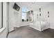 Light bedroom boasts a full-size bed, large windows, and tile floors at 2828 Peachtree Nw Rd # P 3300, Atlanta, GA 30305