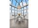 Bright dining area with a striking chandelier and panoramic city views at 2828 Peachtree Nw Rd # P 3300, Atlanta, GA 30305