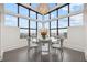 Bright dining area with a striking chandelier and panoramic city views at 2828 Peachtree Nw Rd # P 3300, Atlanta, GA 30305