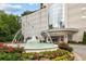 Elegant building entrance with a grand fountain and beautifully landscaped flower beds at 2828 Peachtree Nw Rd # P 3300, Atlanta, GA 30305
