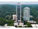 Impressive exterior showing high-rise architecture surrounded by lush greenery, with a pool amenity visible at 2828 Peachtree Nw Rd # P 3300, Atlanta, GA 30305
