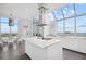 Gourmet kitchen features a large island, stainless steel appliances, and walls of windows at 2828 Peachtree Nw Rd # P 3300, Atlanta, GA 30305