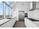 Modern kitchen featuring stainless steel appliances, white cabinets, and a large center island at 2828 Peachtree Nw Rd # P 3300, Atlanta, GA 30305