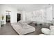Bright living room with a modern sectional sofa, tile floors, and unique wall art at 2828 Peachtree Nw Rd # P 3300, Atlanta, GA 30305