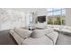 Contemporary living area with unique sofa, glass tables, and expansive windows for abundant light at 2828 Peachtree Nw Rd # P 3300, Atlanta, GA 30305