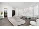 Expansive living room features modern furnishings, unique wall art, and access to the outdoors at 2828 Peachtree Nw Rd # P 3300, Atlanta, GA 30305