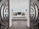 Inviting living room featuring large windows, a modern sofa, and stylish decor, framed by unique doorway at 2828 Peachtree Nw Rd # P 3300, Atlanta, GA 30305