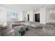Spacious living area with sleek tile flooring, modern sofa, and large windows offering city views at 2828 Peachtree Nw Rd # P 3300, Atlanta, GA 30305