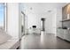 Bright main bedroom with tile floors, king bed, glass top desk and balcony access at 2828 Peachtree Nw Rd # P 3300, Atlanta, GA 30305
