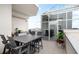 A stylish rooftop patio features an outdoor dining area with enclosed sunroom and city views at 2828 Peachtree Nw Rd # P 3300, Atlanta, GA 30305