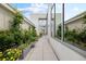 Bright outdoor patio with tile flooring and flower boxes leading to glass entryway at 2828 Peachtree Nw Rd # P 3300, Atlanta, GA 30305