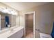 Bathroom features a single sink vanity, shower, toilet, and a linen closet at 1403 Benbrooke Circle Northwest Nw Cir, Acworth, GA 30101