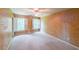 Empty bedroom with unique decor, carpet flooring, ceiling fan, and natural light at 1403 Benbrooke Circle Northwest Nw Cir, Acworth, GA 30101