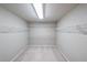 Walk-in closet with carpet flooring and built-in shelving for ample storage at 1403 Benbrooke Circle Northwest Nw Cir, Acworth, GA 30101
