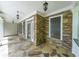 Inviting covered porch with stone flooring and stacked stone columns create a cozy outdoor space at 1403 Benbrooke Circle Northwest Nw Cir, Acworth, GA 30101