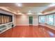 Open living room boasts hardwood floors, recessed lighting, and a built-in entertainment center at 1403 Benbrooke Circle Northwest Nw Cir, Acworth, GA 30101