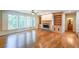 Bright living room featuring hardwood floors, a cozy fireplace, and large windows at 1403 Benbrooke Circle Northwest Nw Cir, Acworth, GA 30101