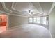 Large bedroom featuring decorative ceilings, fan, carpeting, and shuttered windows at 1403 Benbrooke Circle Northwest Nw Cir, Acworth, GA 30101