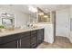 Double vanity bathroom features a glass shower, and updated cabinetry with a neutral color scheme at 228 Stone Park Dr, Woodstock, GA 30188