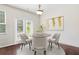 Charming dining area with a round table, elegant chairs, and natural light at 228 Stone Park Dr, Woodstock, GA 30188