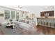 Bright, open concept living area with modern furnishings and hardwood floors at 228 Stone Park Dr, Woodstock, GA 30188