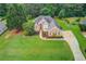 Beautiful brick home showcasing lush lawn and long driveway at 3072 Parks Run, Loganville, GA 30052