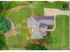 Aerial view of the home showcasing the roof, driveway, and landscaping at 3072 Parks Run, Loganville, GA 30052