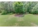Spacious backyard featuring a large lawn and mature trees at 3072 Parks Run, Loganville, GA 30052