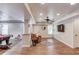 Finished basement boasts neutral paint, wood-look floors, recessed lights, a brown leather recliner, and a game area at 3072 Parks Run, Loganville, GA 30052