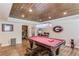 Basement game room has a pool table and wood ceiling at 3072 Parks Run, Loganville, GA 30052