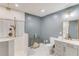 Bathroom with a glass shower, a toilet, and a gray vanity with gold hardware at 3072 Parks Run, Loganville, GA 30052