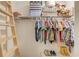 Organized closet with wooden ladder, shelves, and storage solutions for clothes and items at 3072 Parks Run, Loganville, GA 30052