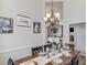 Dining room with a chandelier, a long wooden table and tall ceilings at 3072 Parks Run, Loganville, GA 30052