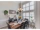 Formal dining room with tall windows and a stylish chandelier at 3072 Parks Run, Loganville, GA 30052