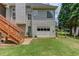 Exterior view of the home featuring a garage and stairs to a porch at 3072 Parks Run, Loganville, GA 30052