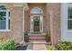 Inviting front entrance with a lovely door and surrounding landscaping at 3072 Parks Run, Loganville, GA 30052