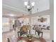 Bright open concept view of the living room, dining area, and kitchen with breakfast bar and stainless steel appliances at 3072 Parks Run, Loganville, GA 30052