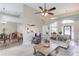 Bright living room featuring neutral tones, a ceiling fan, and an open floor plan that connects the kitchen and dining area at 3072 Parks Run, Loganville, GA 30052